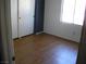 This bedroom features a closet and hardwood floors at 1927 Raspberry Hill Rd, Las Vegas, NV 89142