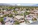 Expansive aerial view showcasing a well-planned community with mountain views and manicured landscapes at 2113 Waterbury Ln, Las Vegas, NV 89134