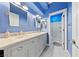 Well-lit bathroom features double sinks with marble countertops and a step-in shower at 2113 Waterbury Ln, Las Vegas, NV 89134