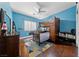 Cheerful bedroom with a custom bunk bed, wood floors, and ample natural light at 2113 Waterbury Ln, Las Vegas, NV 89134