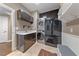 Well-lit laundry room boasts a sink, modern appliances, storage, and decorative tile flooring at 2113 Waterbury Ln, Las Vegas, NV 89134