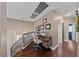 Upstairs loft area with hardwood floors provides a dedicated office space and natural light at 2113 Waterbury Ln, Las Vegas, NV 89134