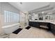Bright main bathroom with a soaking tub, glass enclosed shower, and dual vanity at 2113 Waterbury Ln, Las Vegas, NV 89134