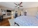 Comfortable main bedroom features a fireplace, built-in bookshelves, and access to a walk-in closet at 2113 Waterbury Ln, Las Vegas, NV 89134