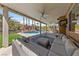 An outdoor seating area offers clear views of the backyard oasis and inviting pool at 2113 Waterbury Ln, Las Vegas, NV 89134