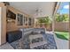 This covered patio includes an outdoor seating arrangement and a TV for entertainment at 2113 Waterbury Ln, Las Vegas, NV 89134