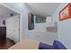 This playroom has a small gray couch and access to additional storage space at 2113 Waterbury Ln, Las Vegas, NV 89134