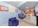 This is a colorful, fun playroom with blue walls, cozy furniture and engaging decor at 2113 Waterbury Ln, Las Vegas, NV 89134