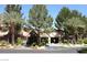 Attractive community entrance, featuring well-maintained landscaping, mature trees, and a welcoming facade at 2200 S Fort Apache Rd # 2062, Las Vegas, NV 89117