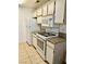 Efficient kitchen with white appliances, granite countertops, and ample cabinetry, creating a practical cooking space at 2200 S Fort Apache Rd # 2062, Las Vegas, NV 89117