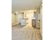 Combined kitchen and living area featuring tile flooring, neutral walls, and standard appliances, creating a cozy living space at 2200 S Fort Apache Rd # 2062, Las Vegas, NV 89117