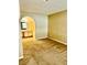 Spacious main bedroom with neutral carpet and an arched doorway leading to an ensuite bathroom, offering a relaxing retreat at 2200 S Fort Apache Rd # 2062, Las Vegas, NV 89117