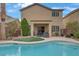 Backyard pool and spa area with lush landscaping and a patio at 2445 Rue Royale, Henderson, NV 89044