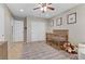 Comfortable Bedroom with crib, closet, and cozy chair at 2445 Rue Royale, Henderson, NV 89044
