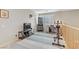 Spacious upstairs bonus room featuring neutral walls, shutters, and exercise equipment at 2445 Rue Royale, Henderson, NV 89044