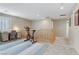 Bright bonus room featuring exercise equipment, desk, shutters, and neutral decor at 2445 Rue Royale, Henderson, NV 89044