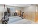 Upstairs bonus room featuring exercise equipment, desk, shutters, and neutral decor at 2445 Rue Royale, Henderson, NV 89044