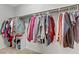 Walk-in closet with hanging clothes and storage at 2445 Rue Royale, Henderson, NV 89044