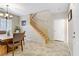 Open floor plan featuring a dining area, stairway and neutral wall color scheme at 2445 Rue Royale, Henderson, NV 89044