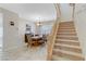 Open floor plan featuring a dining area, stairway, and tile floors at 2445 Rue Royale, Henderson, NV 89044