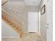 Inviting entryway with stairs, tile floors, and neutral wall color scheme at 2445 Rue Royale, Henderson, NV 89044