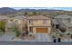 Charming two-story home with a well-maintained front yard and attached two car garage at 2445 Rue Royale, Henderson, NV 89044