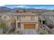 Charming two-story home with a well-maintained front yard and attached two car garage at 2445 Rue Royale, Henderson, NV 89044