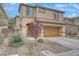Charming two-story home boasting a two-car garage and low maintenance desert landscaping at 2445 Rue Royale, Henderson, NV 89044