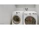 The laundry room features a white washer and dryer set at 2445 Rue Royale, Henderson, NV 89044