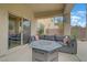 Comfortable covered patio with a seating area perfect for enjoying the outdoors at 2445 Rue Royale, Henderson, NV 89044