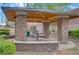 The stone pavilion with picnic benches is a great community gathering space at 2445 Rue Royale, Henderson, NV 89044