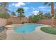 Backyard pool and spa area with lush landscaping and a patio at 2445 Rue Royale, Henderson, NV 89044