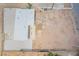 A high angle aerial shot shows the roof, adjacent patio area and surrounding desert yard at 266 Tungsten St, Henderson, NV 89015