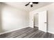 Light bedroom featuring gray wood floors, a ceiling fan, and access to the bedroom at 266 Tungsten St, Henderson, NV 89015