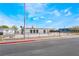 An eye-level front view of a home with a flat backyard under a blue sky at 266 Tungsten St, Henderson, NV 89015