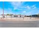 An eye-level front view of a home with a flat backyard under a blue sky at 266 Tungsten St, Henderson, NV 89015