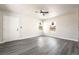 Bright living room featuring gray hardwood flooring, neutral walls, and a ceiling fan at 266 Tungsten St, Henderson, NV 89015