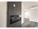 Close-up of modern linear fireplace with gray wood floors and white walls at 266 Tungsten St, Henderson, NV 89015