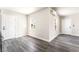 Bright living room featuring gray hardwood flooring and freshly painted walls at 266 Tungsten St, Henderson, NV 89015