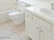Bathroom with white tile, tub, and white cabinets at 2753 Devita Cir, Las Vegas, NV 89117