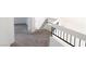 Open hallway with neutral carpet and modern railing at 2753 Devita Cir, Las Vegas, NV 89117