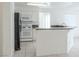 Clean kitchen boasting modern appliances, and a breakfast bar with granite countertops at 2753 Devita Cir, Las Vegas, NV 89117