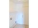 Bright laundry room with tile floors, washer/dryer hookups, and convenient access to the exterior at 2753 Devita Cir, Las Vegas, NV 89117