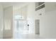 Bright, airy living room featuring high ceilings and sliding glass doors, perfect for entertaining at 2753 Devita Cir, Las Vegas, NV 89117
