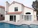 This home features a private pool with a patio, tile roof, and a stucco exterior at 2753 Devita Cir, Las Vegas, NV 89117