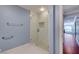A modern bathroom features a glass-enclosed shower, tiled walls, and a tiled shower floor at 281 Powerbilt Ave, Las Vegas, NV 89148