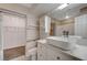 Bathroom featuring a modern vanity with vessel sink and access to a walk-in closet at 281 Powerbilt Ave, Las Vegas, NV 89148
