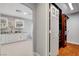 View of stylish ensuite bathroom with dual sinks and a walk-in closet entrance at 281 Powerbilt Ave, Las Vegas, NV 89148