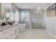 Elegant bathroom features a soaking tub, glass shower, and stylish vanity with a vessel sink at 281 Powerbilt Ave, Las Vegas, NV 89148