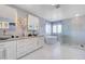 Bright bathroom with dual vanities, a soaking tub, and a glass-enclosed shower at 281 Powerbilt Ave, Las Vegas, NV 89148
